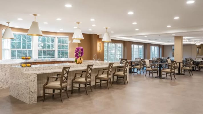 Bright dining area with modern decor and seating