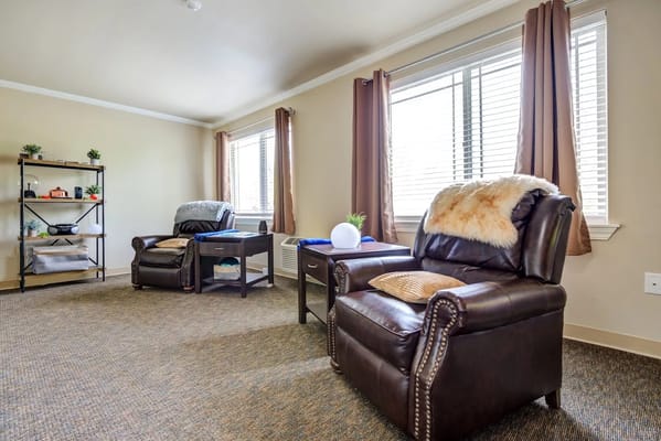 Comfortable seating area with armchairs and a small table