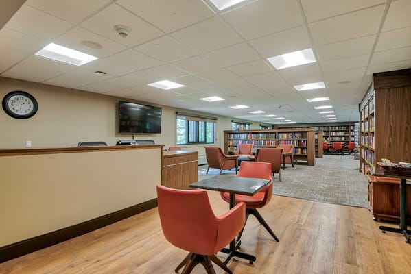 Interior view of a library area in a senior living facility