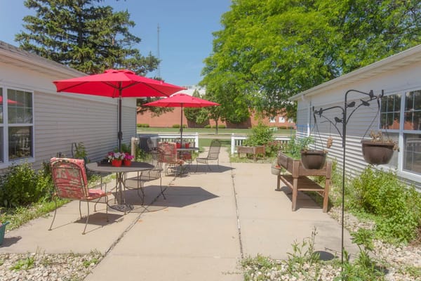 Patio area with red umbrellas and seating