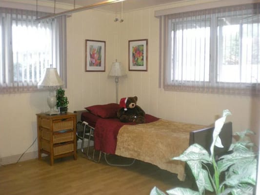 Cozy resident room with bed and decorations