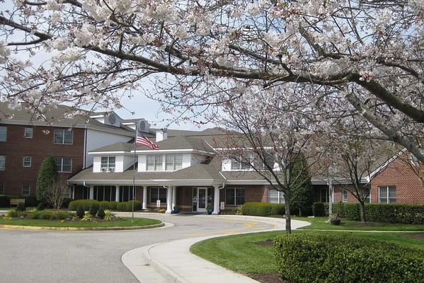 Front view of Karolwood Gardens with blooming cherry trees