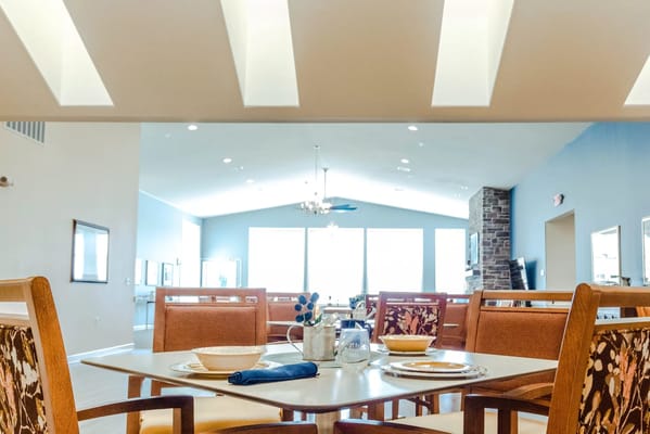 Bright dining area with tables set for a meal
