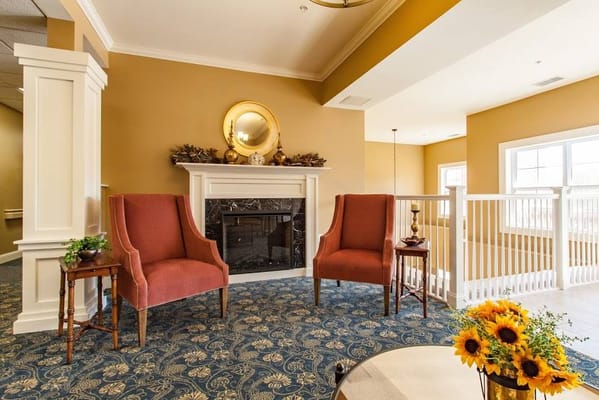 Cozy seating area in a common space with plants