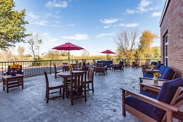 Outdoor seating area with umbrellas and flowers