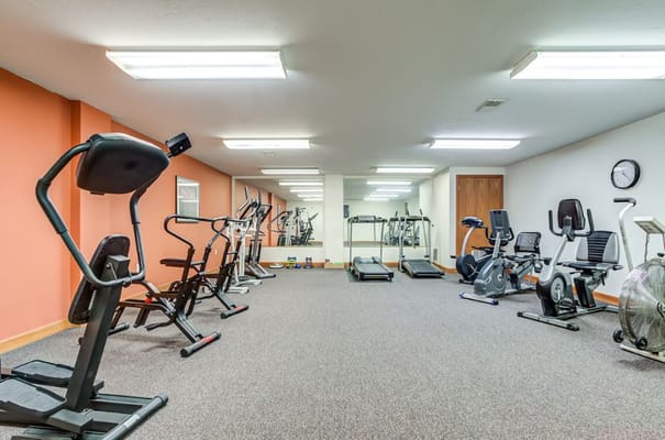 Bright fitness room with exercise equipment