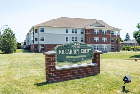 Exterior view of Killarney Court with signage