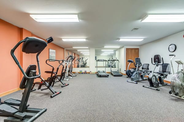 Bright fitness room with exercise equipment