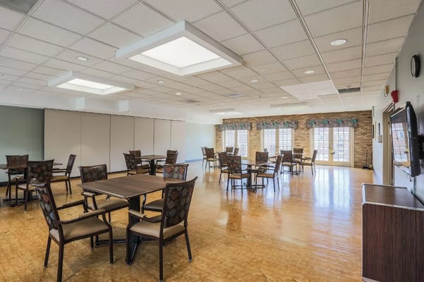 Bright common area with tables and chairs