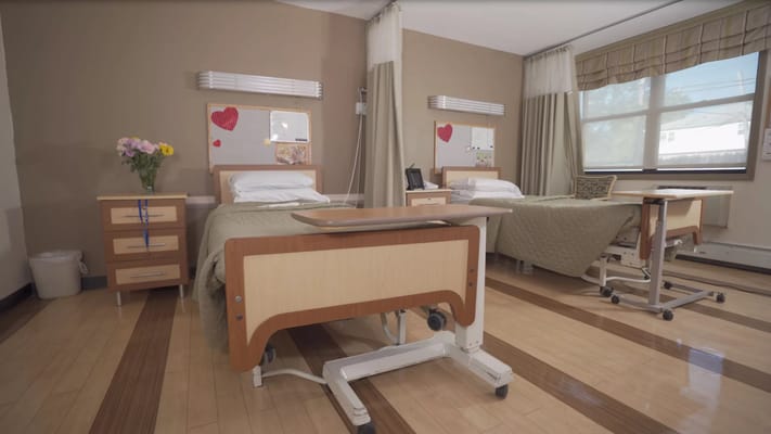 Interior view of a shared room with two beds