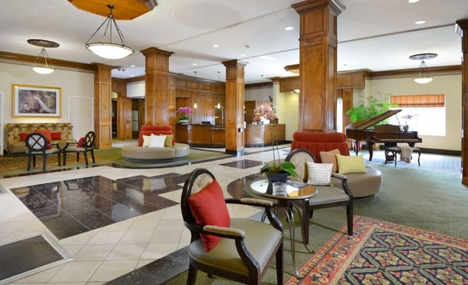 Elegant common area with seating and a piano