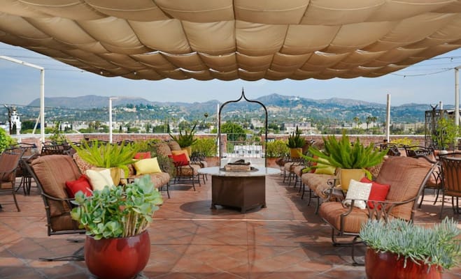 Rooftop terrace with seating and mountain views