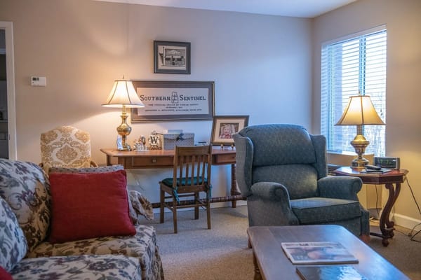 Cozy interior lounge area with seating and lamps