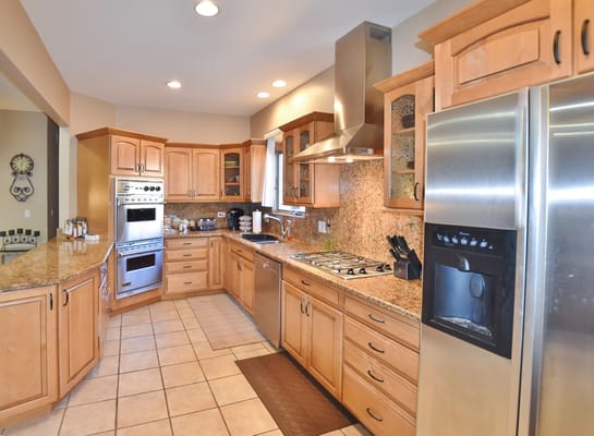 Well-equipped kitchen with wooden cabinets