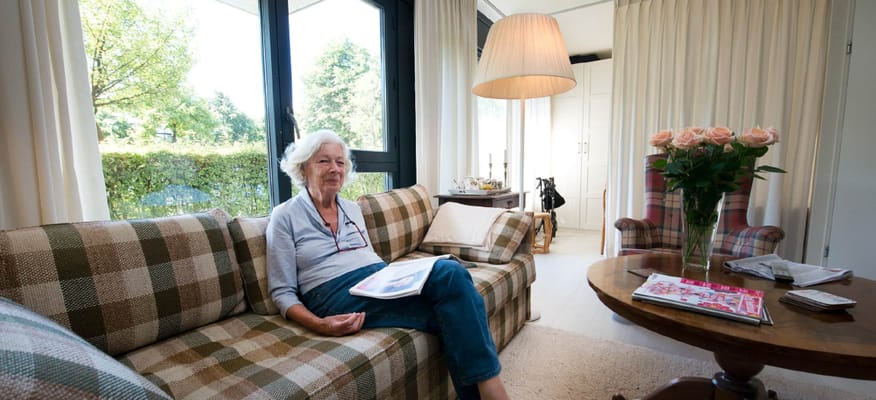 Resident enjoying a quiet moment in a cozy living area