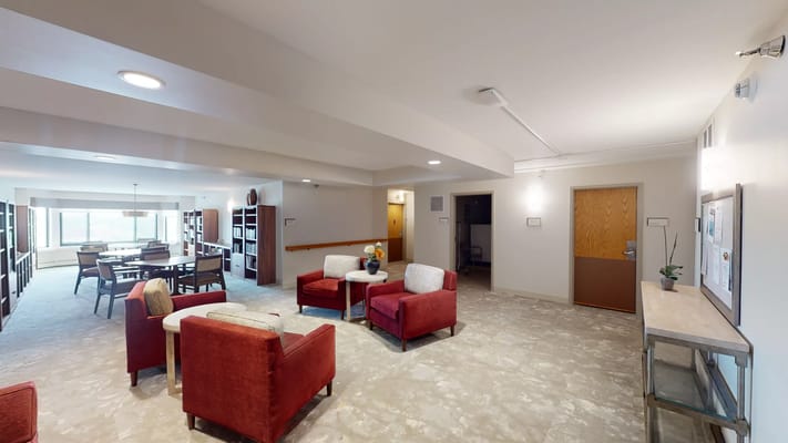 Common area with seating and bookshelves