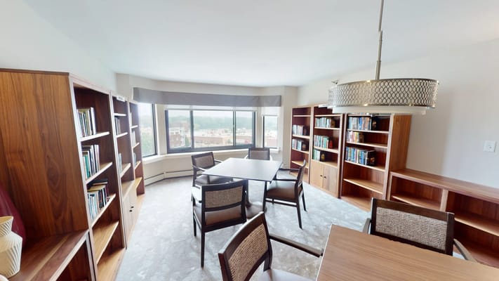 Interior common area with bookshelves and seating