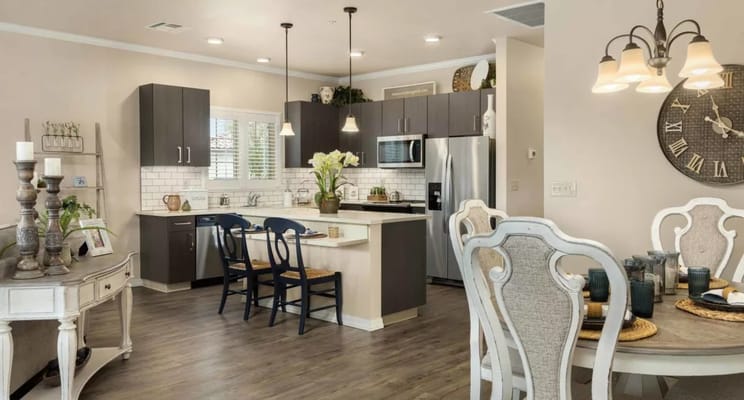 Bright kitchen with dining area in a senior living facility