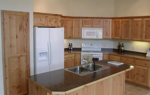 Modern kitchen with wooden cabinets and appliances