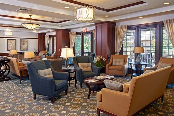 Common area in a senior living facility with comfortable seating