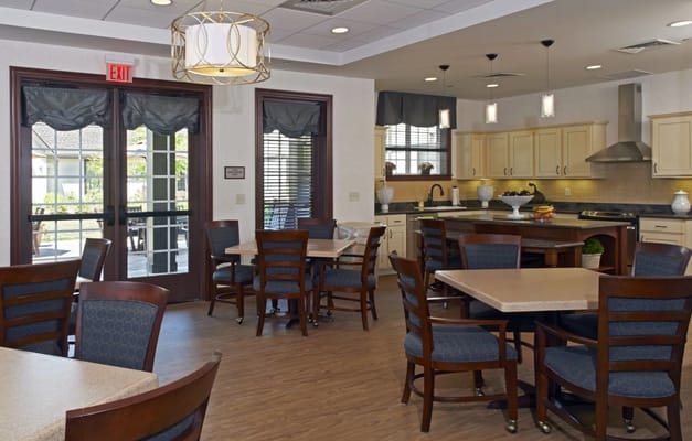 Dining area with tables and chairs for residents