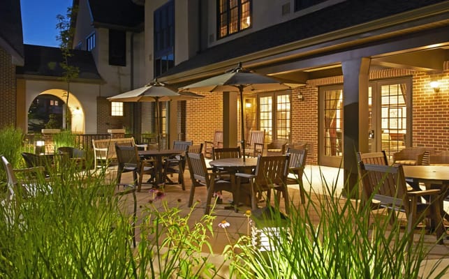 Outdoor seating area with tables and umbrellas