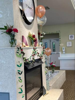 Decorated fireplace area in the common room