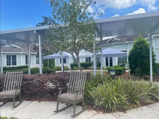 Outdoor seating area with views of residential buildings