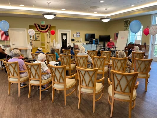Residents enjoying live music in a common area