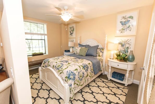 A well-decorated resident room with floral bedding