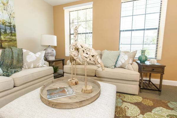 Cozy sitting area with decorative sculpture and comfortable sofas