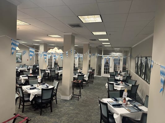 Bright dining room with festive decorations and seating
