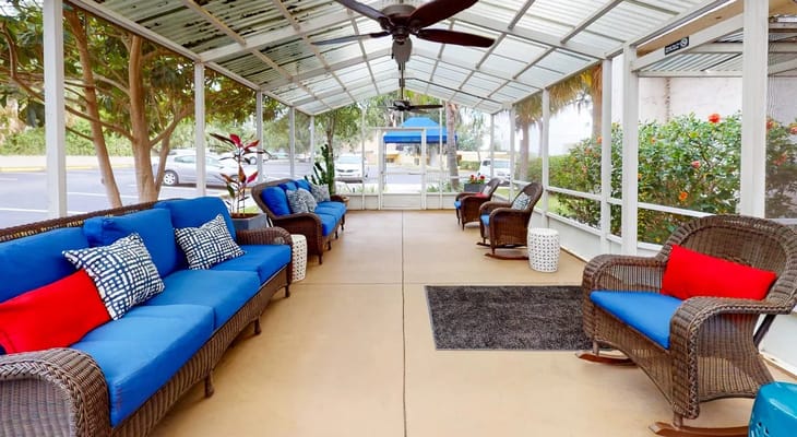 Covered outdoor seating area with comfortable chairs