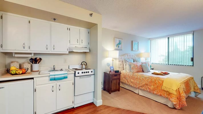 Cozy interior of a resident room with a kitchen area