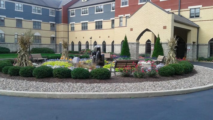Beautifully landscaped outdoor space with flowers and benches.