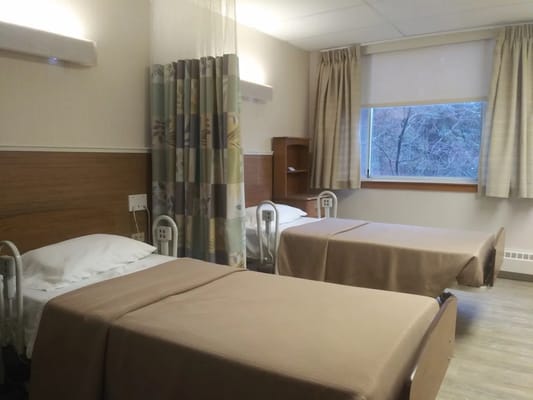 Interior view of a resident bedroom with two beds