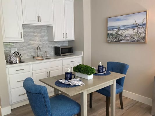 Cozy dining area with a kitchenette in a senior living room