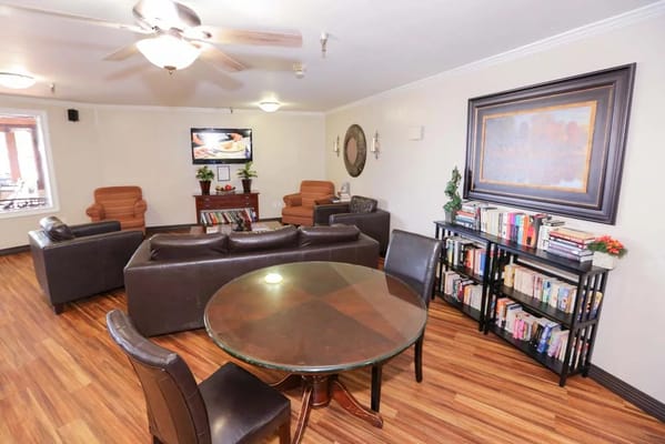 Interior common area with seating and bookshelves