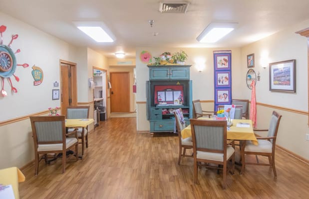 Bright dining room with tables and chairs