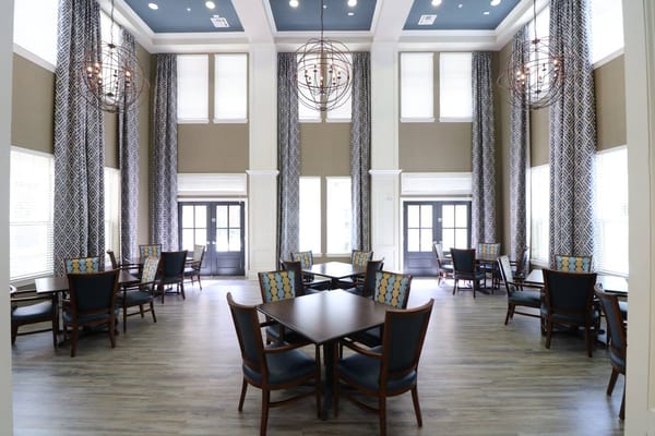 Bright common area with tables and chairs
