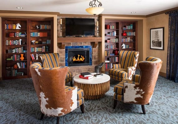 Cozy common area with seating and bookshelves