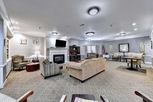 Common area with seating and fireplace