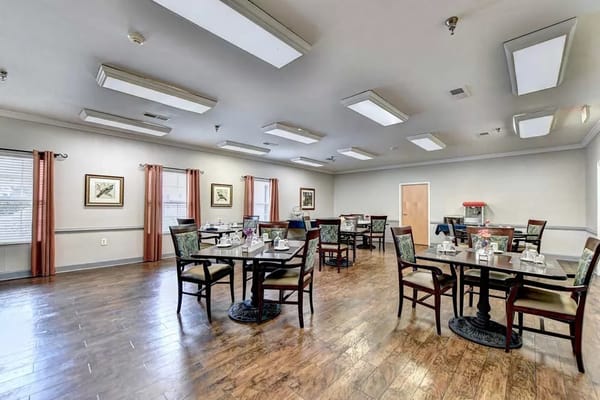 Dining room with tables and chairs set for meals