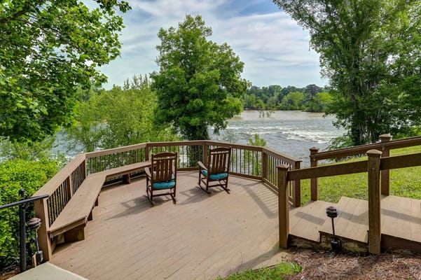 Deck with rocking chairs overlooking a river