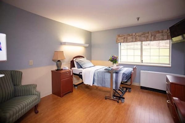 Well-furnished private resident room with a bed and window