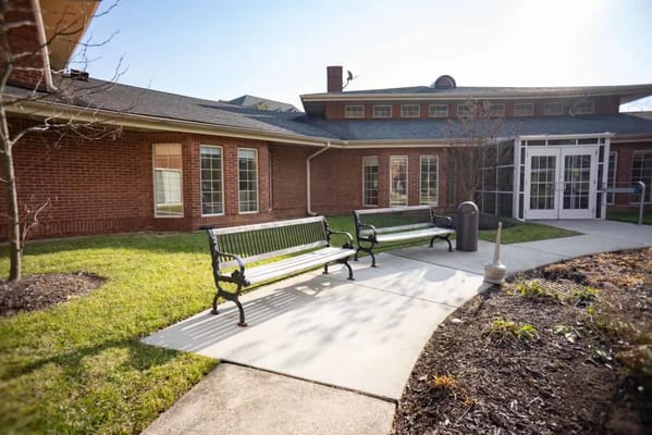 Outdoor seating area with benches and landscaping