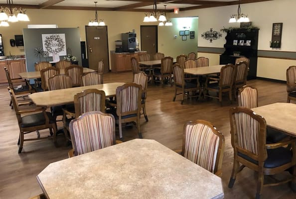 Interior dining area with wooden tables and chairs
