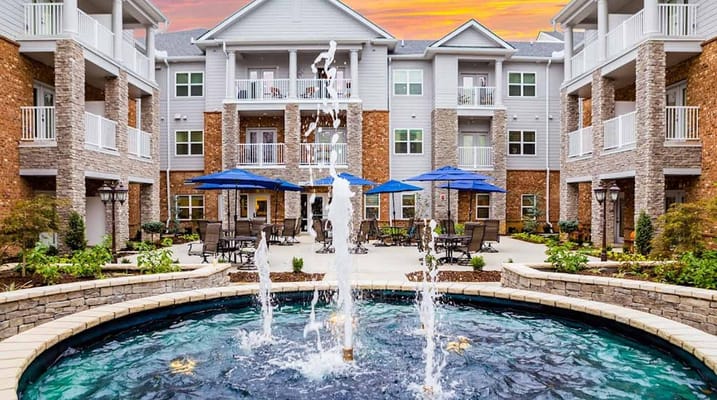 Outdoor courtyard with fountain and seating areas