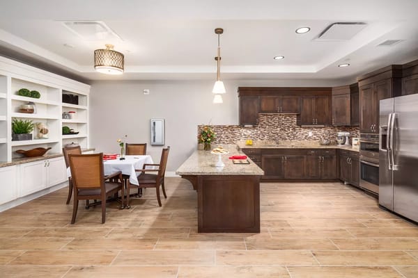 Spacious kitchen with dining area and modern appliances