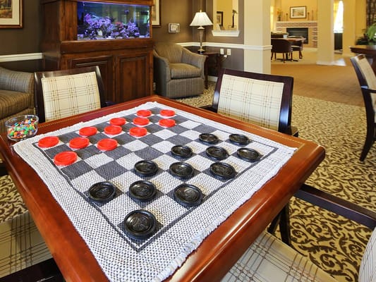 Indoor checkers game set up on a table